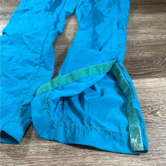 Vtg 80s Nike Track Pants Women M Aqua Blue Windbreaker Pants Side Pockets - Picture 2 of 7